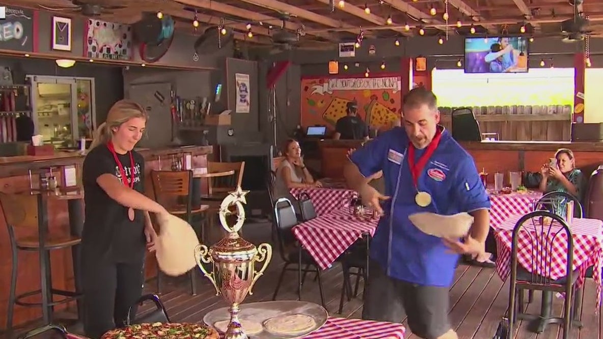 Tossing pizza dough with Safety Harbor's international winner